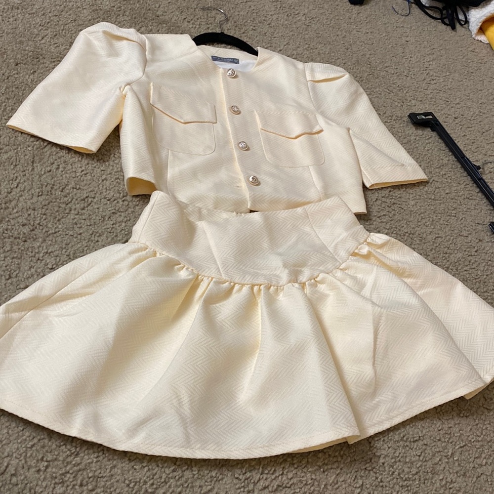 Two pieces crop top and skort. Good fabric brand new.